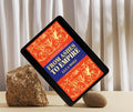 Self improvement journal ebook: From Ashes to Empire displayed on a tablet surrounded by stones.